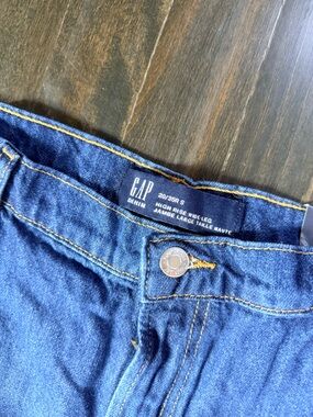 GAP women's high-rise, wide leg jeans in Dark Blue Denim with studs.